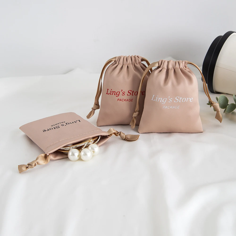 

100pcs Custom Jewelry Drawstring Gift Bag 9x12cm Wedding Candy Packaging Pouches High Quality Silk Satin Ring Necklace Organizer
