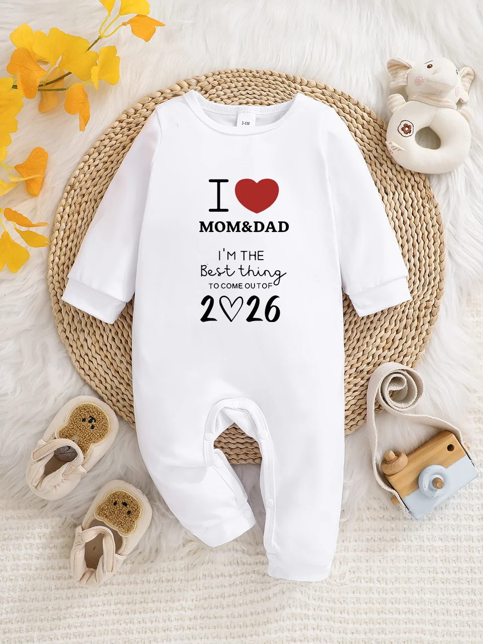 Baby long-sleeved bodysuit with fun letter prints, button design, easy care, suitable for new parents.