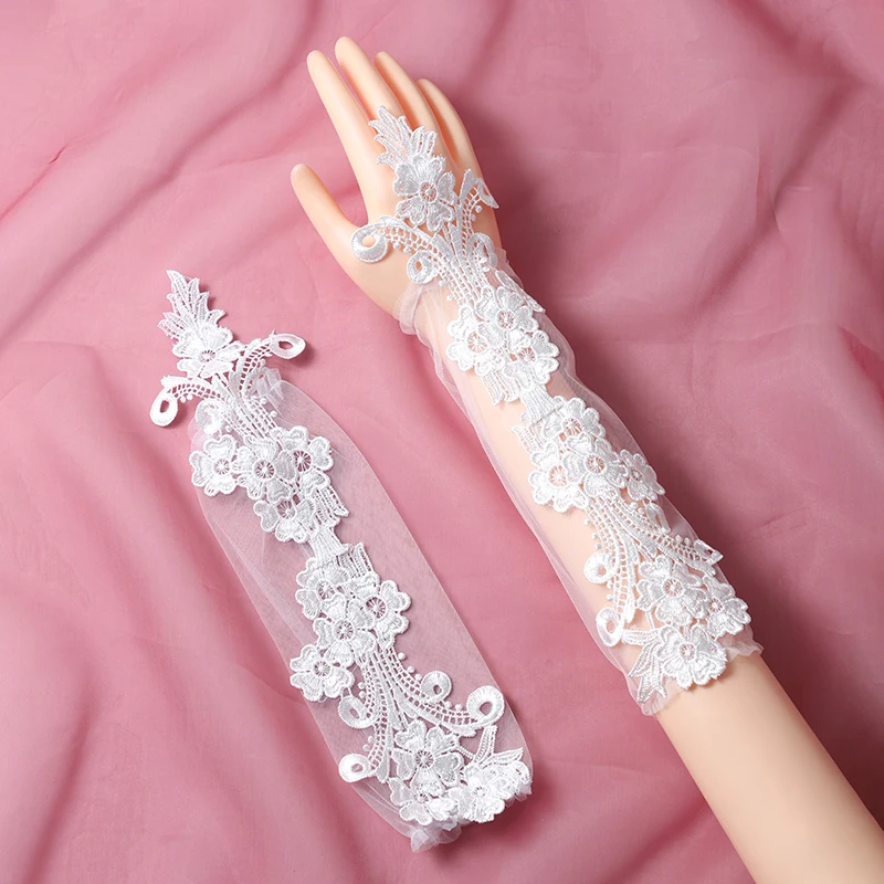 The bride's accessory is a pair of white ring style long gloves suitable for women's wedding parties