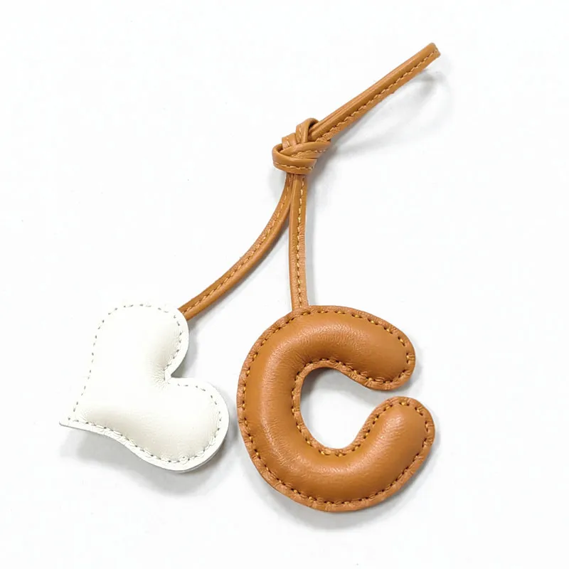 Genuine leather C with heart-shaped letter style bag decoration with pure handmade stitching, high-end car keychain accessories