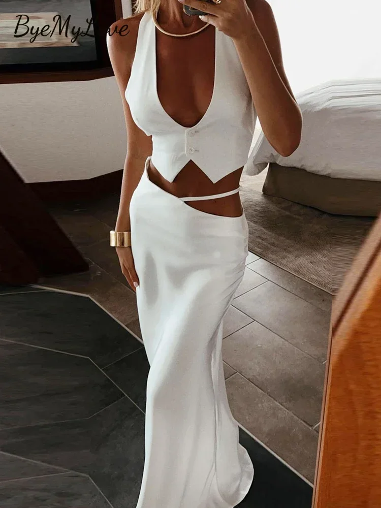 

Женский комплект из двух предметов: Шелковый укороченный топ с длинной юбкой и юбка макси