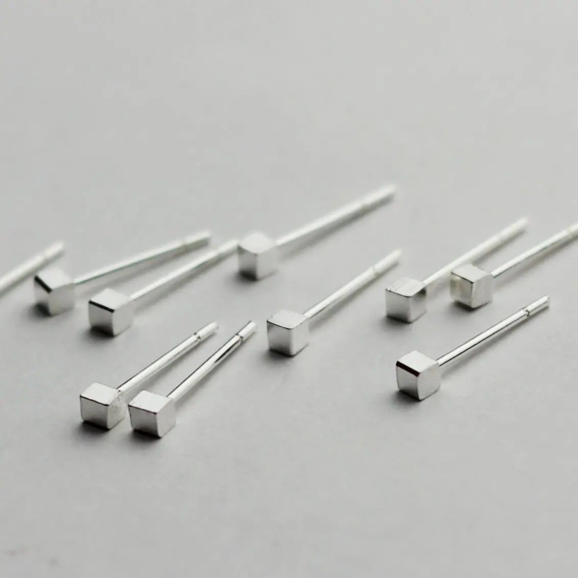 Best-selling celebrity-similar cubic-shaped earrings with fringes, elegant and sweet look for women. Korean silver jewelry.