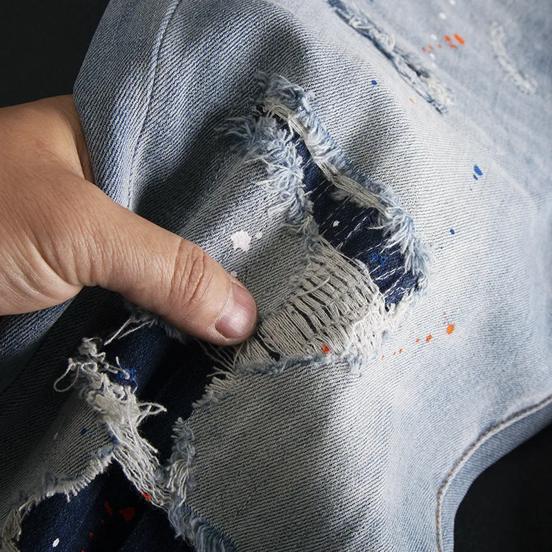 Splash ink ripped jeans for men, slim fit with small feet, elastic and scraped patch design, spring/summer 2025 new pants
