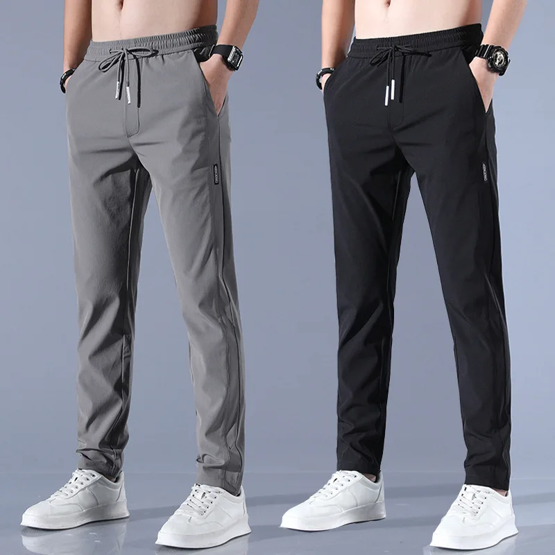 2024 nuovi pantaloni da uomo in seta di ghiaccio tinta unita a vita media pantaloni Casual larghi e traspiranti a gamba dritta pantaloni sportivi sottili ad asciugatura rapida