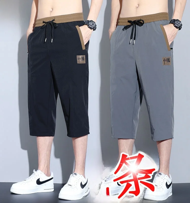 

Мужские летние повседневные спортивные брюки из тонкого ледяного шелка, свободные прямые брюки на семи футов, модные молодежные брюки базового цвета