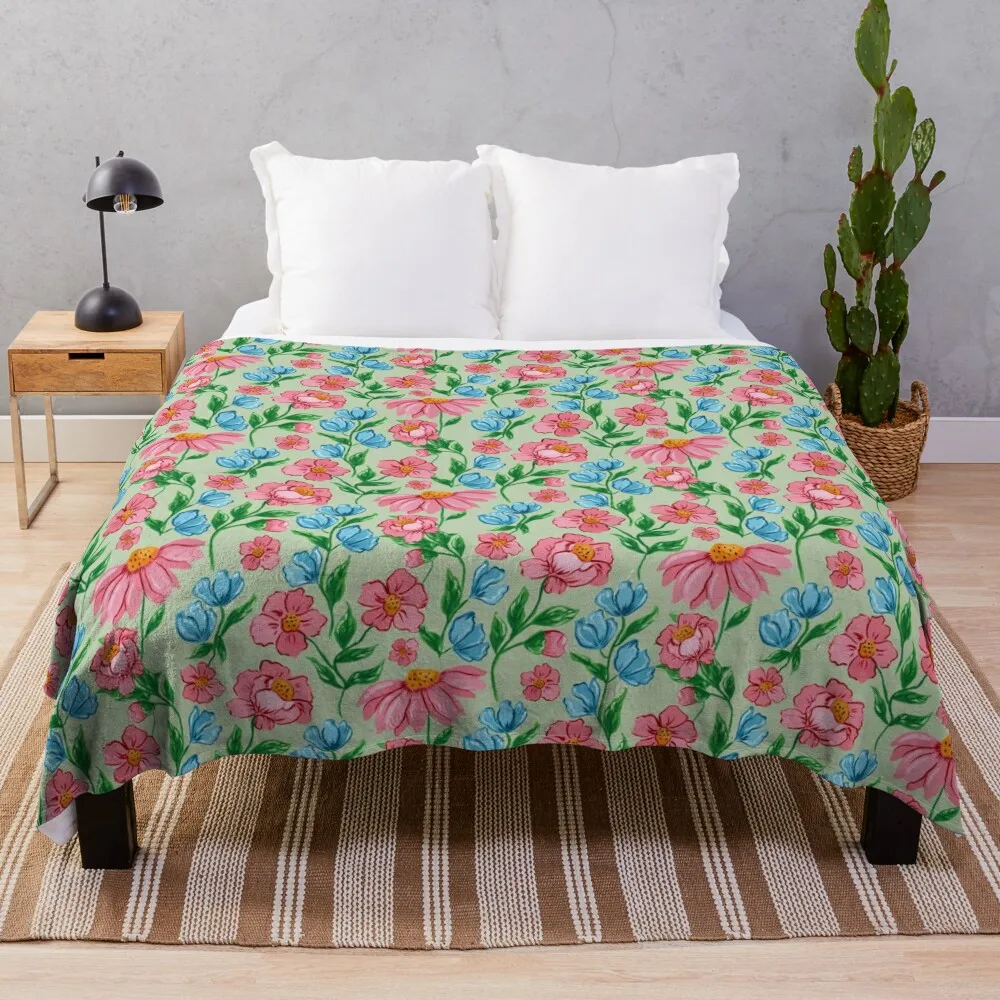 Hand painted painterly feminine gouache pink flowers and blue flowers on a light green background Throw Blanket