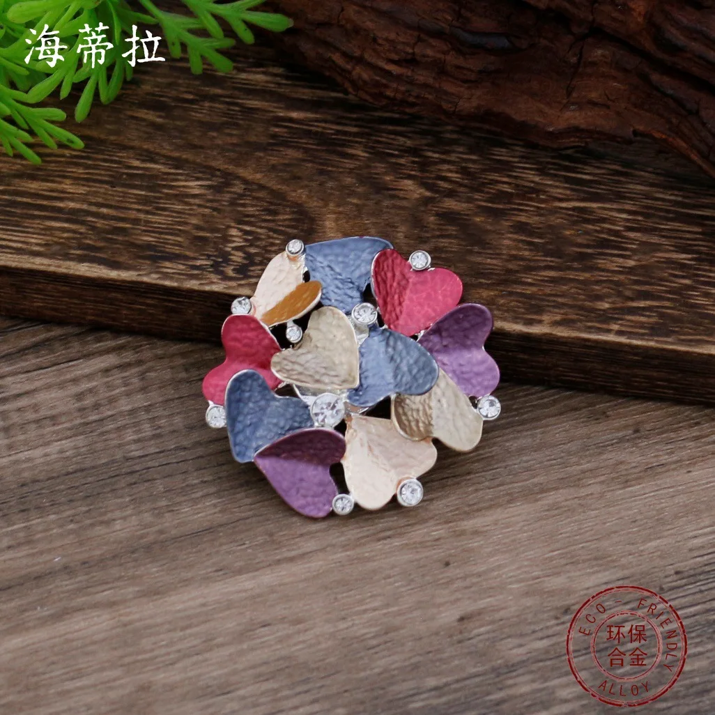 

hot-selling enamel color hollow love magnetic brooch women's simple high-end heart-shaped multi-functional corsage