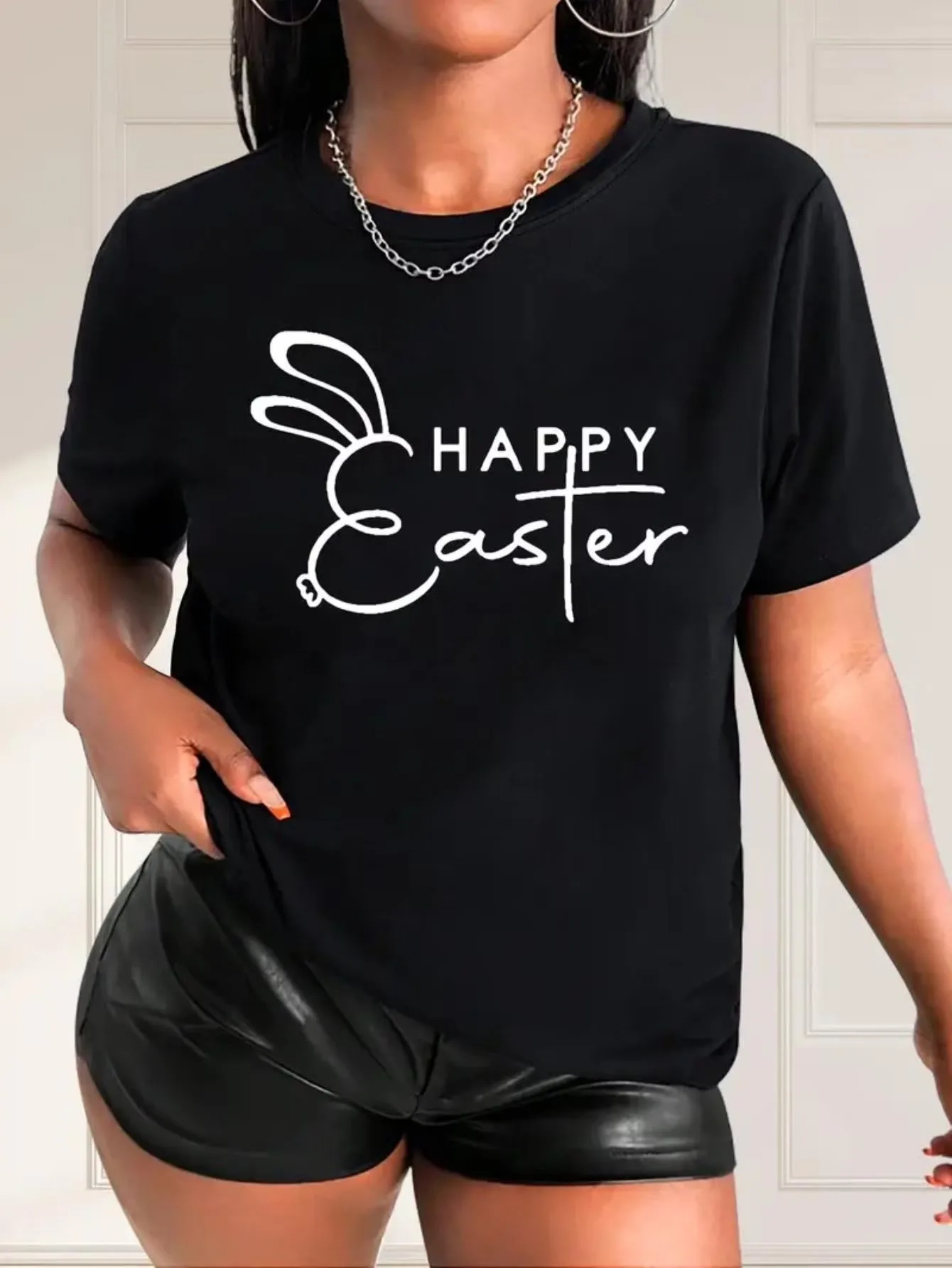 

Black Happy Easter T-Shirt with Bunny Graphic Perfect for Easter Celebrations Delivering Festive Vibe and Casual Style for Women