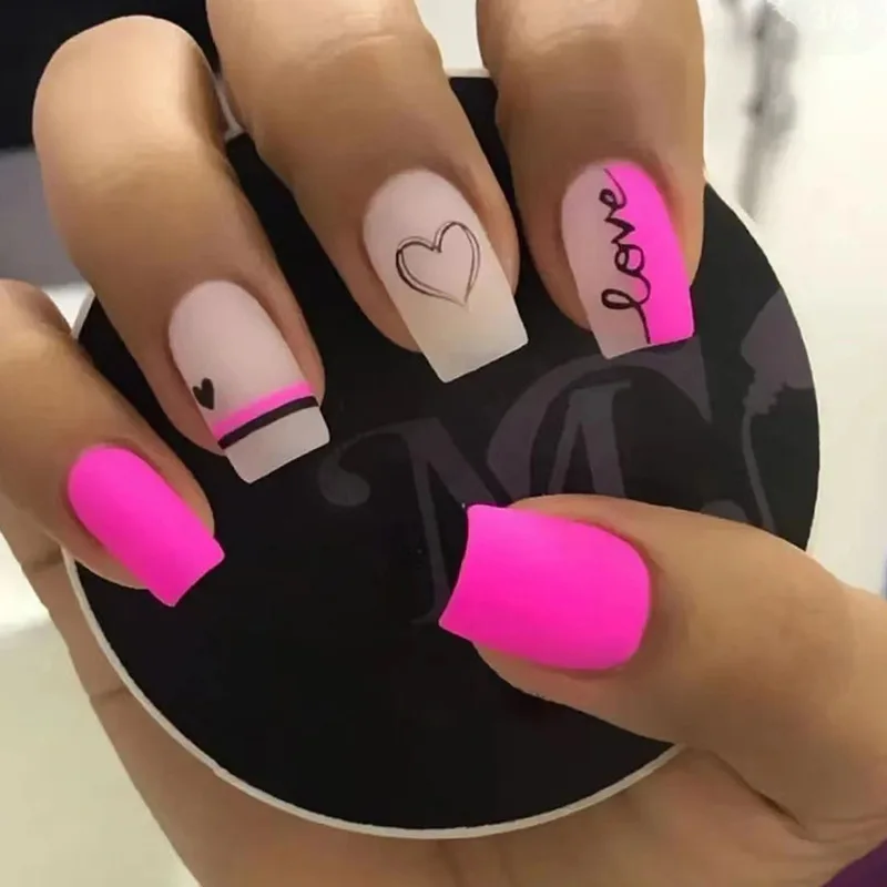 

24Pcs Medium Coffin Press-on Nails: Pink Matte with Black Hearts & 'LVOE' Doodle - Sweet Edgy Style