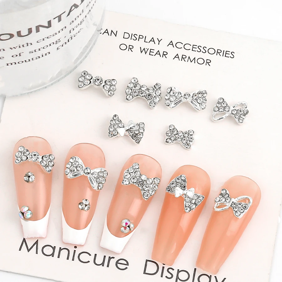 SANANIE 10PCS Shiny White Rhinestone Bow Nail Art Charms 3D Classic Sliver Alloy Butterfly Nails Decoration Manicure Supplies 5