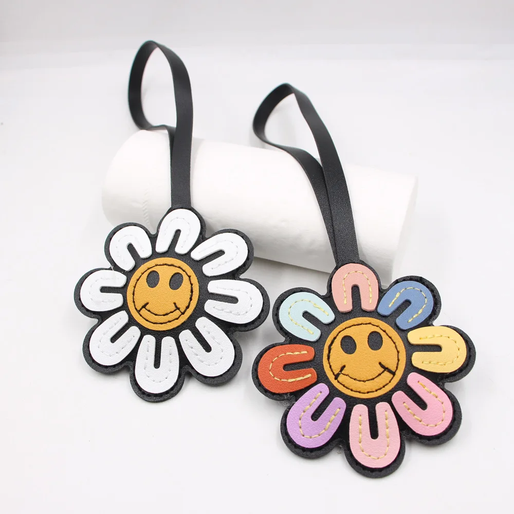 1 portachiavi girasole con faccia gioiosa e fiore, accessorio per auto in ecopelle, decorazione alla moda per borse e telefoni, idea regalo