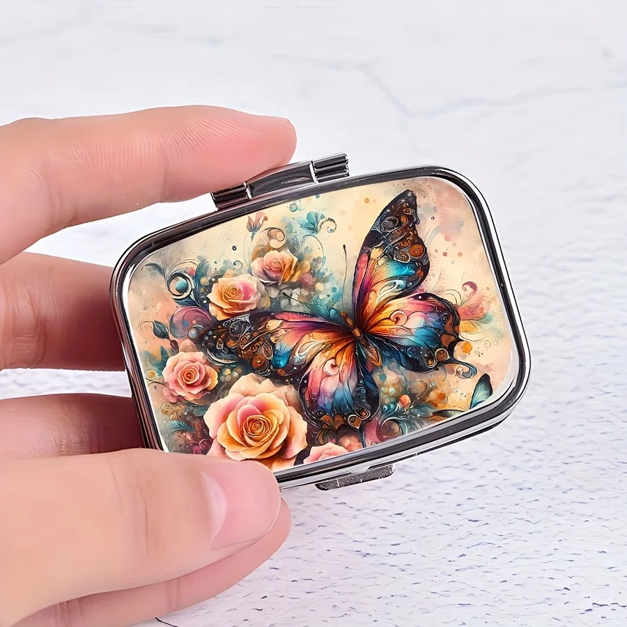 A Colorful Butterfly Floral Pattern Portable Pill Box - a Double-Compartment Metal Pill Box with a Safety Clasp, Compact and Portable, Can Hold Vitamin Supplements, Doubles as a Decorative Piece, Ideal Gift for Health-Conscious Individuals, Can Be Used in a Wallet.