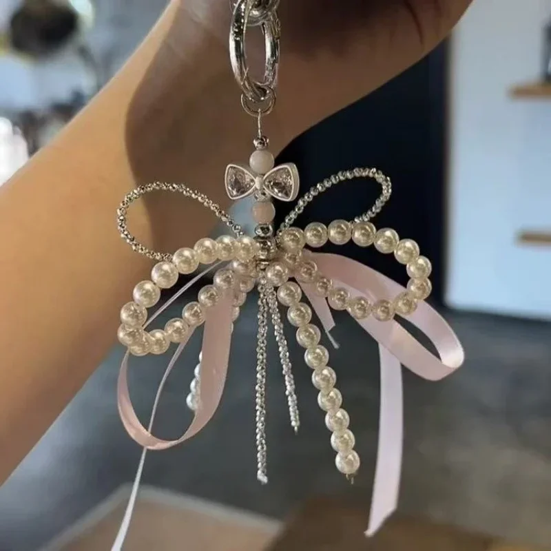 2025 جديد الكورية موضة الحلو اللؤلؤ القوس المفاتيح قلادة هاتف كيرينغ Y2K Ins حامل الجمالية لفتاة حقيبة قلادة اكسسوارات