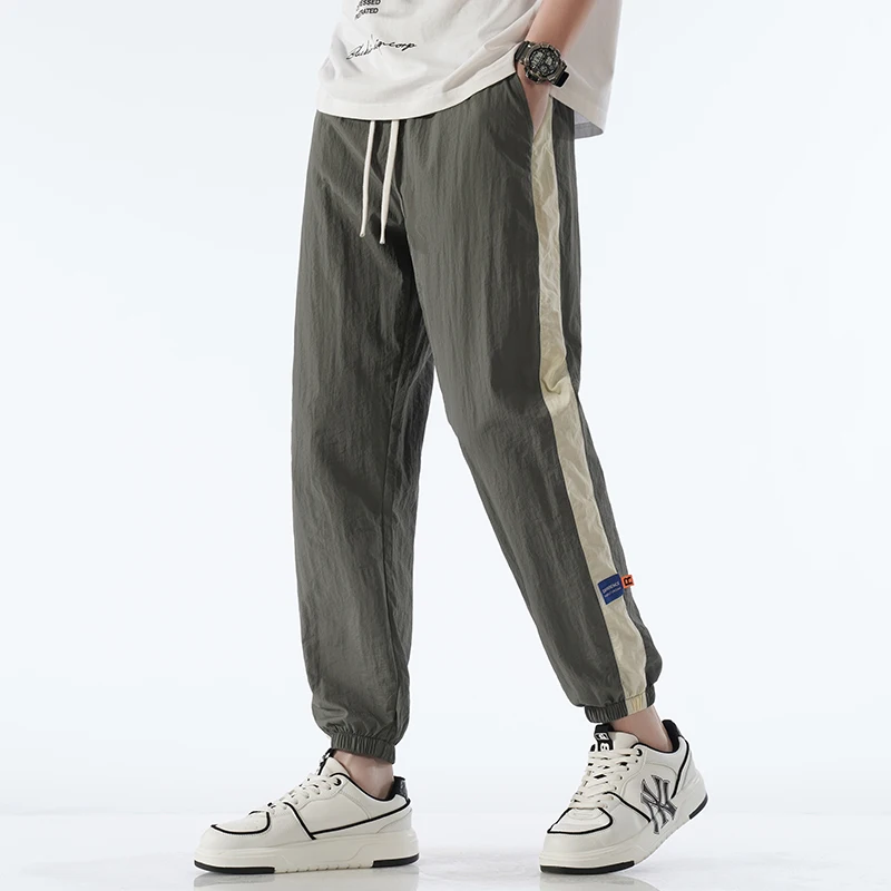 

Ice Silk Casual Pants for Men's Summer Thin 2024 New Loose and Draping Large Striped 9-point Strap Sports Pants