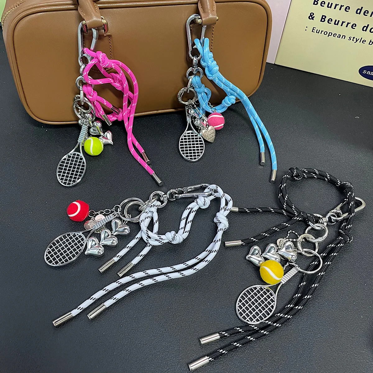 

Small and niche woven rope hiking buckle bag pendant tennis keychain couple personalized hand rope For iPhone 17 16