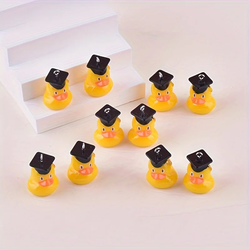 

12 piece set of 3D cartoon graduation duck resin pendant (with black duck shell) - DIY jewelry pendant in yellow and orange color, suitable for making earrings, necklaces, graduation season gift accessories, fun design, fine craftsmanship, glossy surface