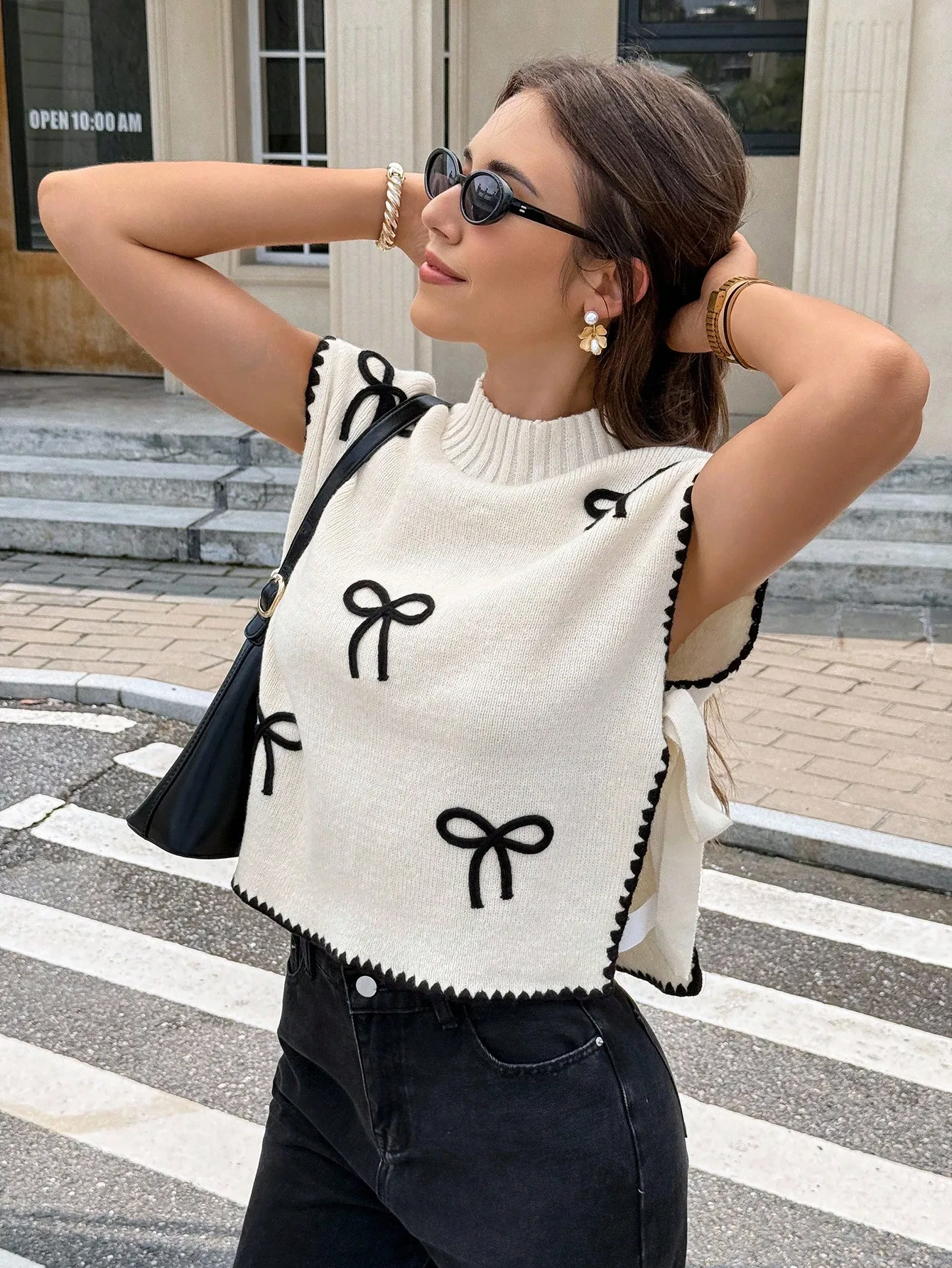 

Cream Knit Sleeveless Sweater Vest with Black Bow Embroidery and Trim