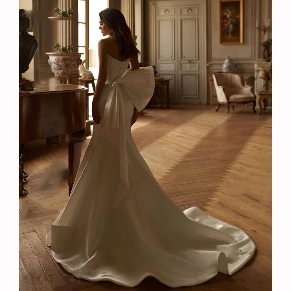 Dostosowana suknia ślubna Sweetheart syrenka 2025 kokarda satynowa suknia panny młodej Plus rozmiar księżniczka Vestido de Noiva szata de Mariée