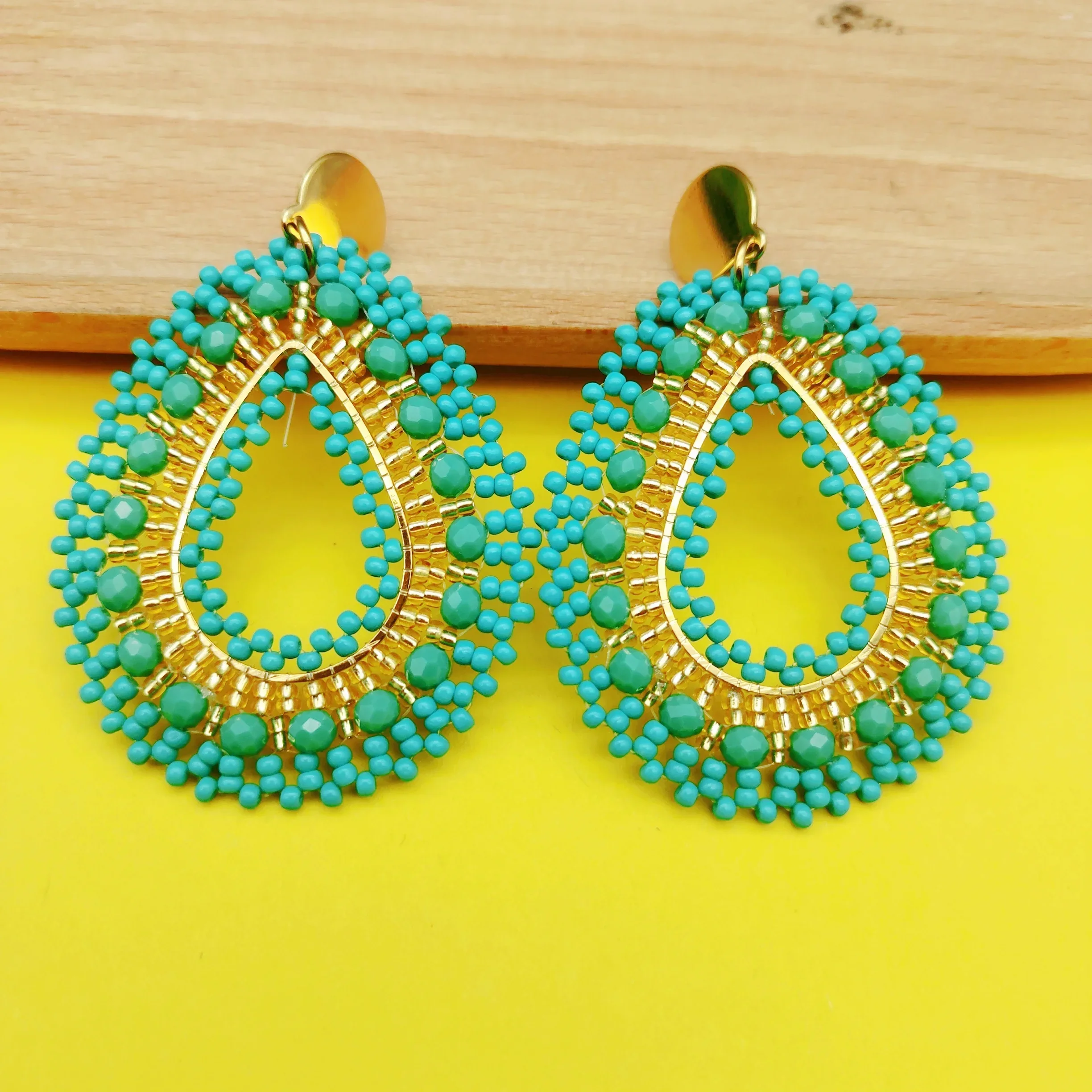 Beaded earrings Water drop Originality Female Hollow out Crystal Hand knitting Bohemia Alloy Tide Simple Rice bead earrings