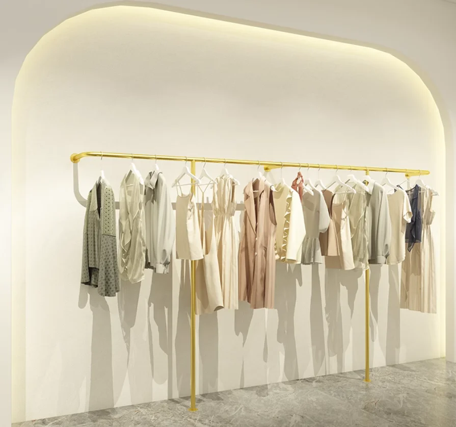 

Clothing store display rack with floor standing wall mounted hangers