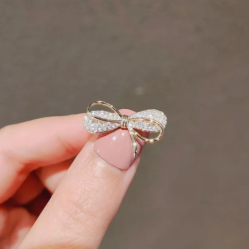 

Модная брошь-булавка с бантом и камнем «кошачий глаз» для женщин, универсальная и милая, предотвращает расстеливание лацканов, фиксирует модные воротники.