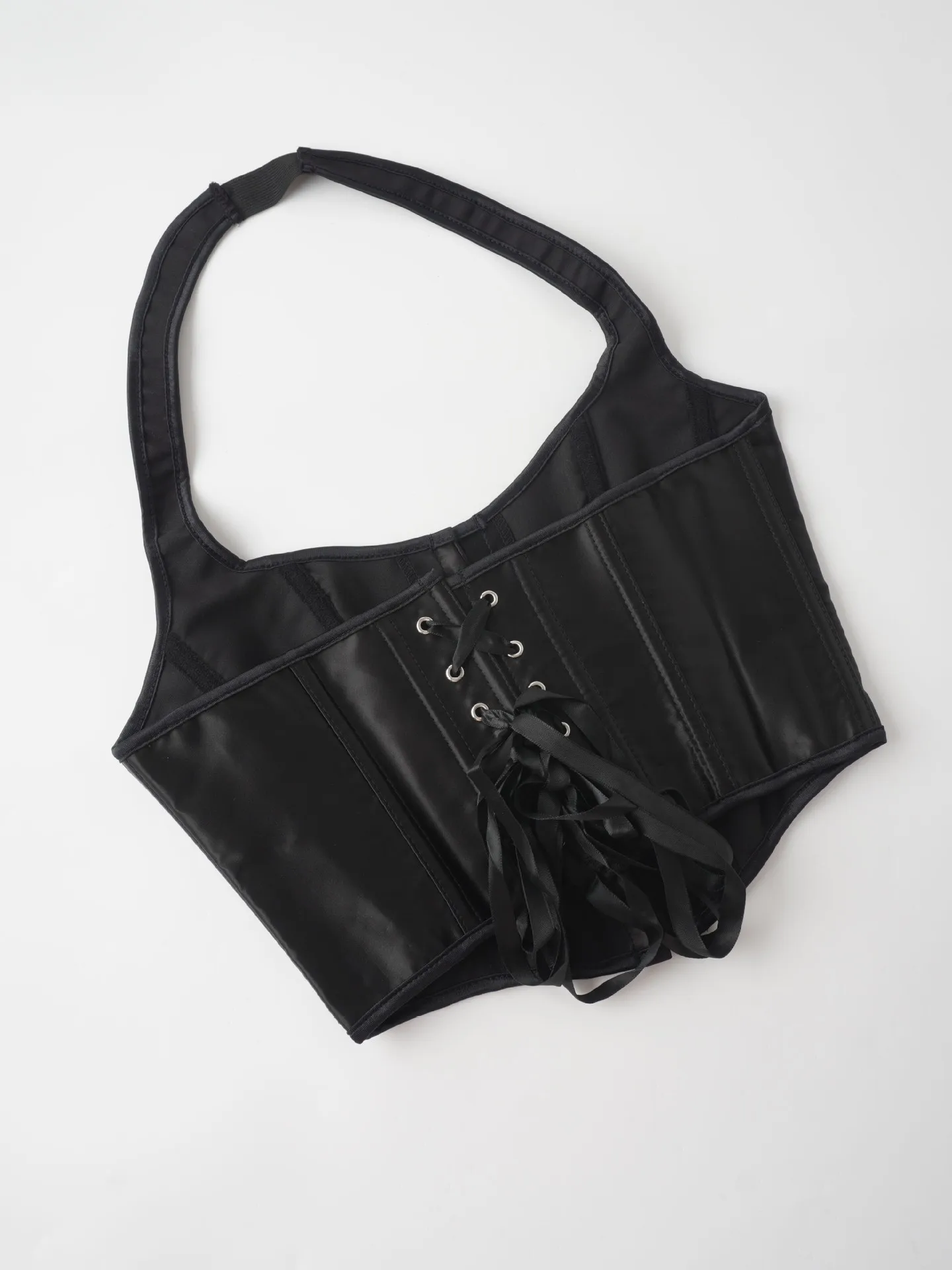 Top corsé de cuero sintético con cuello halter para mujer, con hebilla frontal, cordones en la espalda y diseño que estiliza la cintura. Bustier sexy para uso diario o en fiestas.