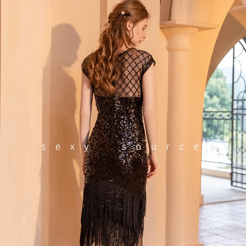 Abito femminile sexy con frange di paillettes O-Collo senza maniche Vedi attraverso la maglia aderente Abito con nappe stanche Abito da banchetto per feste con glitter