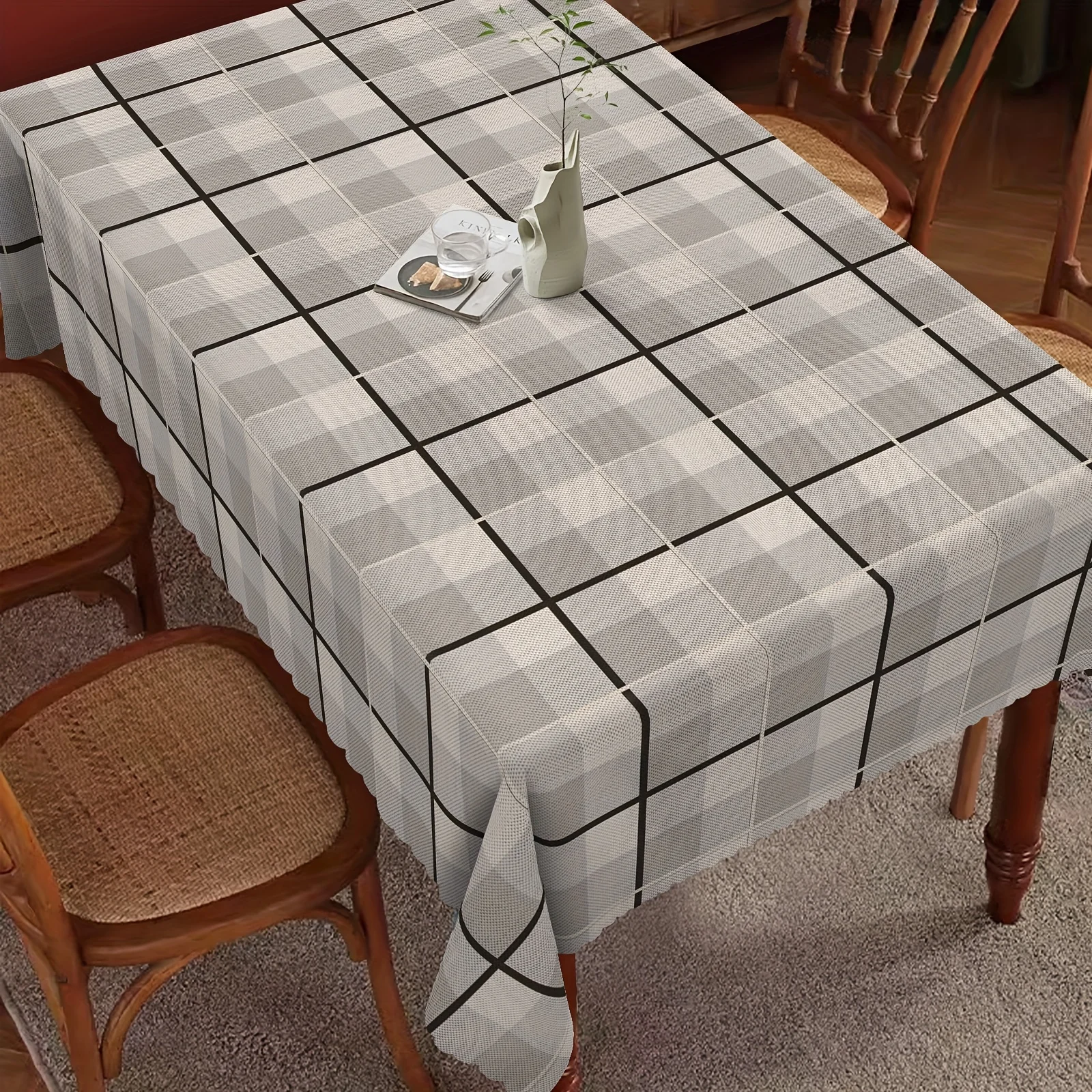 One piece of checkered tablecloth, a rectangular tablecloth, a warm-toned tablecloth, a round tablecloth