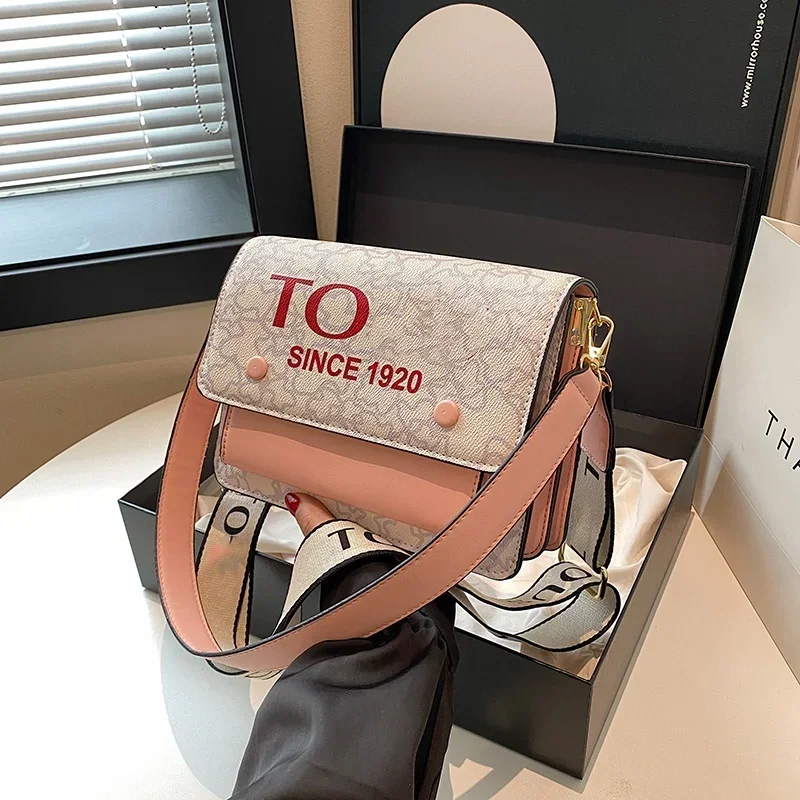 Borsa da donna di vendita calda 2024 borsa a tracolla di moda con cerniera di alta qualità borsa a tracolla portatile alla moda in tela di colore solido