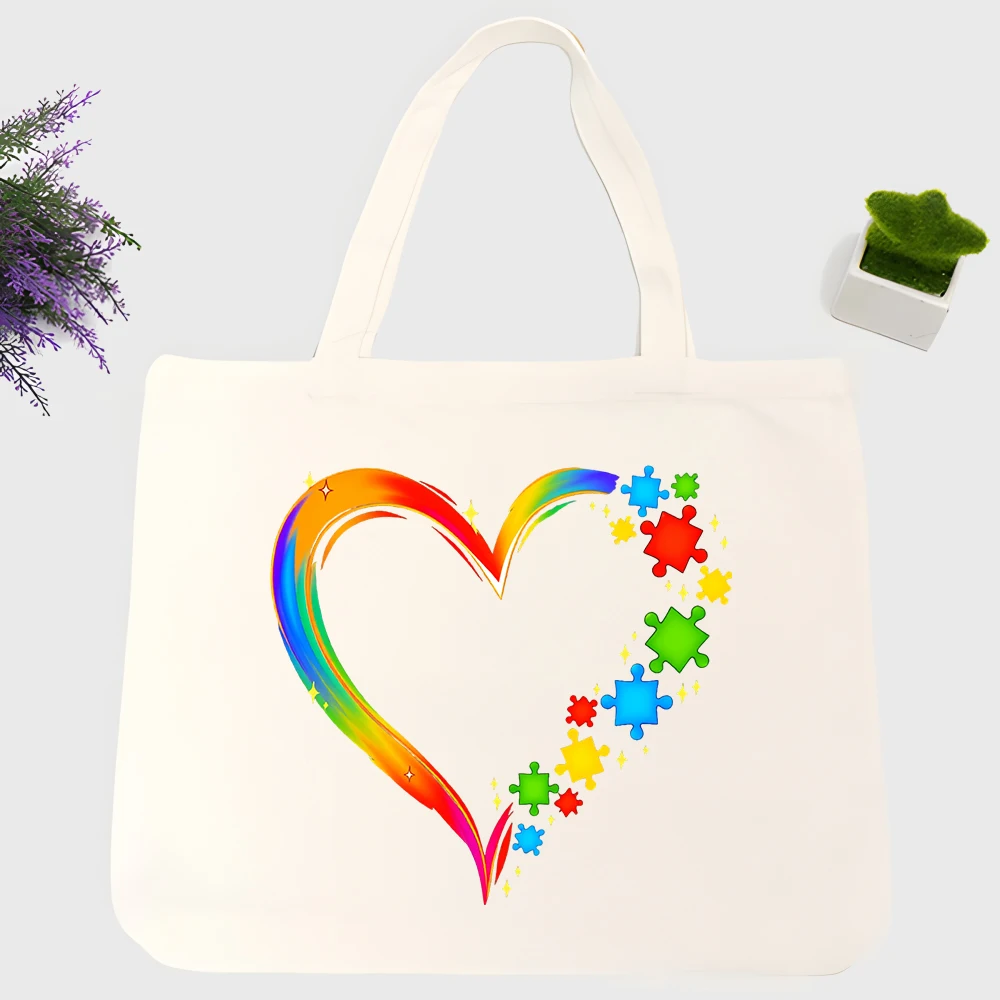 Women's rainbow heart and puzzle piece canvas tote bag, casual style for daily shopping and summer outings
