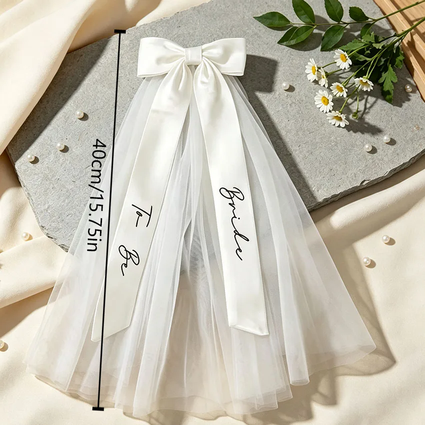 Customized Bridal Veil and Headpiece, Supports Custom Text. Bow-Knot Veil, a Wedding Accessory for the Bride, It Not Only Creates a Wedding Ceremony Atmosphere, but Is Also Suitable for Photo Shoots, Making It a Wedding Accessory Full of Ceremony Feel for the Bride.