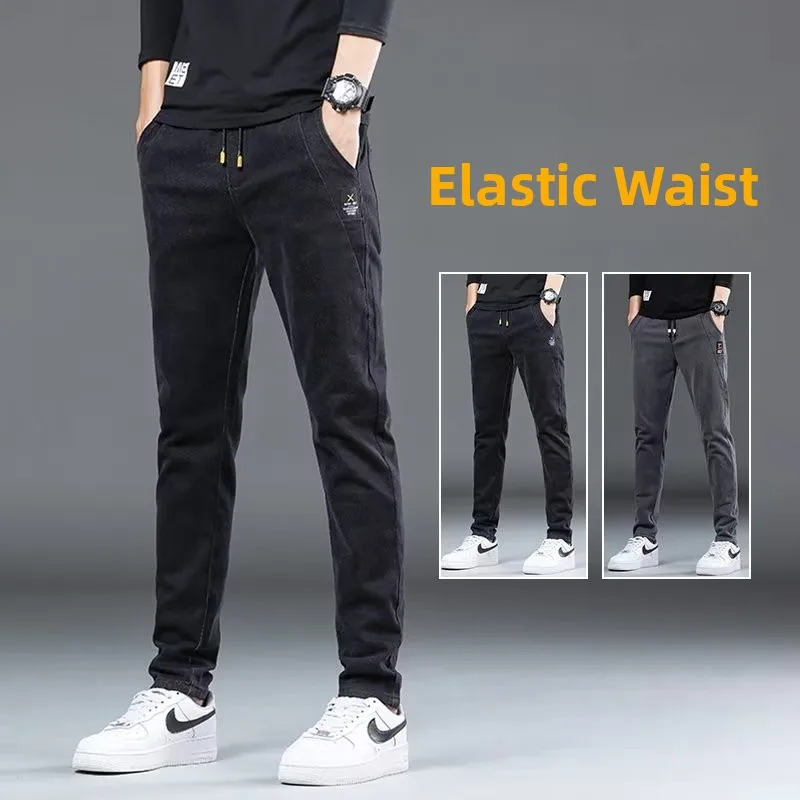 Jeans casual in vita elastica da uomo primavera nuovi pantaloni lunghi larghi a gamba dritta gioventù trendy tessuto denim blu resistente all'usura