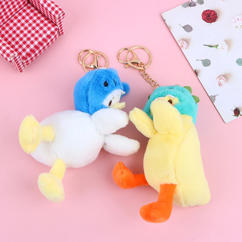 Mochila creativa colgante de bolso de muñeca para niños y niñas, muñeca de moda, nueva serie de pato de cabeza divertida, llavero de coche de juguete de peluche