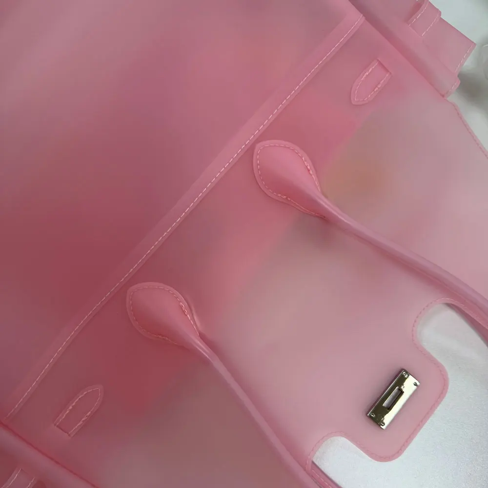 Alt: "Women's Transparent TPU Jelly Tote Bag from Acuvick"