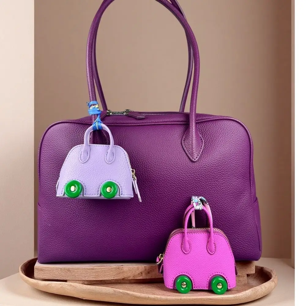 Mini-Taschenanhänger aus Leder mit niedlichen Rädern – Kopfhörer- und Lippenstiftbeutel mit zwei Riemen – PU-Leder – ideal für Taschenzubehör