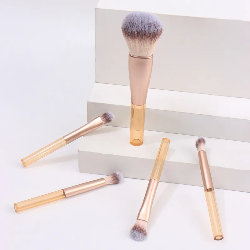 مجموعة جديدة محمولة مكونة من 5 فرش مكياج صغيرة ذات شعيرات ناعمة ذات مقبض قصير من كانغتشو، مقترنة بحقيبة شبكية