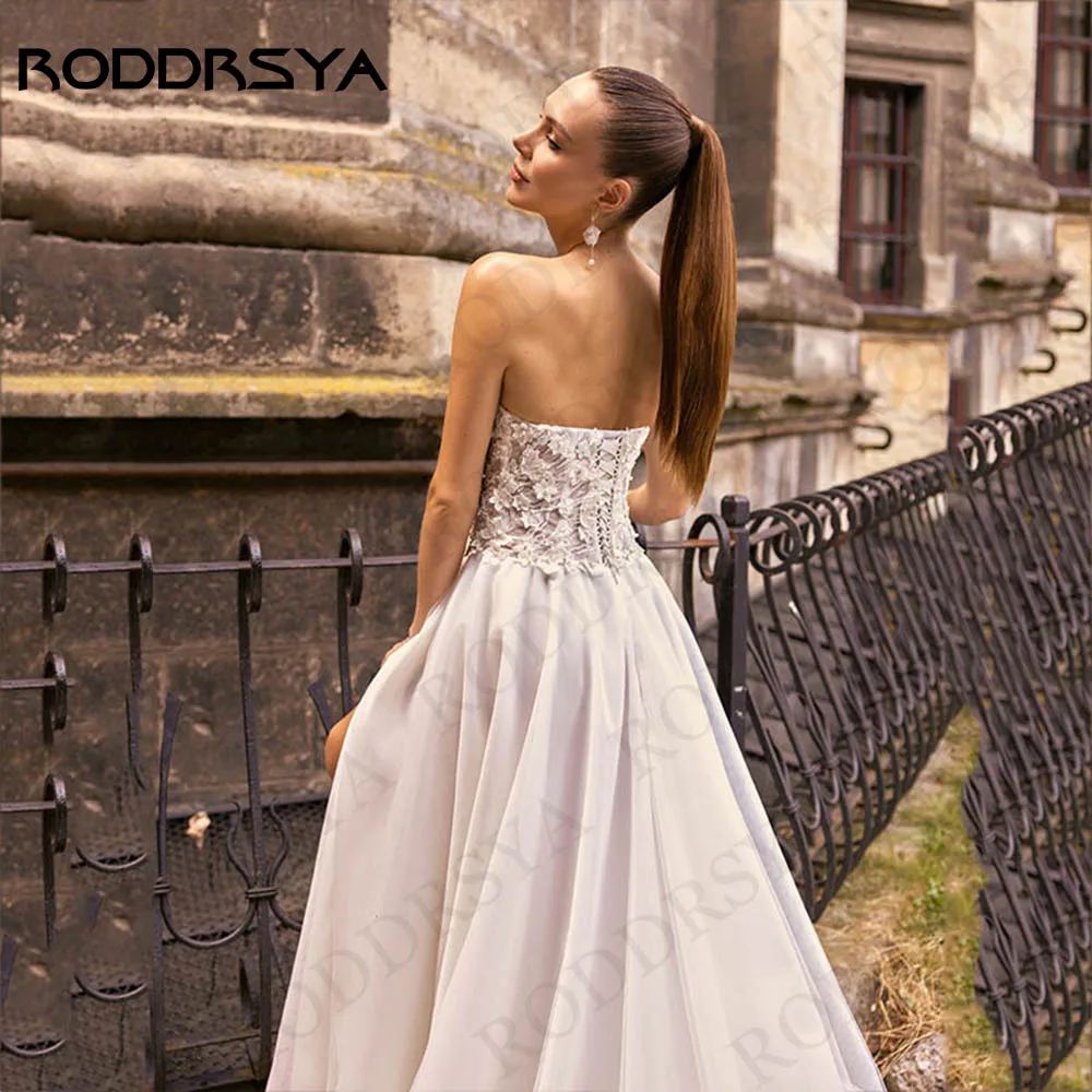 RODDRSYA Boho Vestidos De Casamento 2024 Strapless Tulle Floral Lace Backless Pérolas Applique Vestido De Noiva Split A Line Vestido De Novia Vestidos de noiva Boho 2024 sem alças em tule  Vestido de noiva floral de re