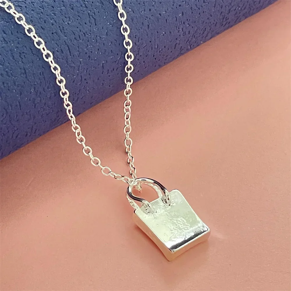 

Подвеска-кулон из стерлингового серебра 925 пробы в форме сумочки для женщин и пар, простое роскошное украшение для банкета, свадьбы, дня рождения, подарок