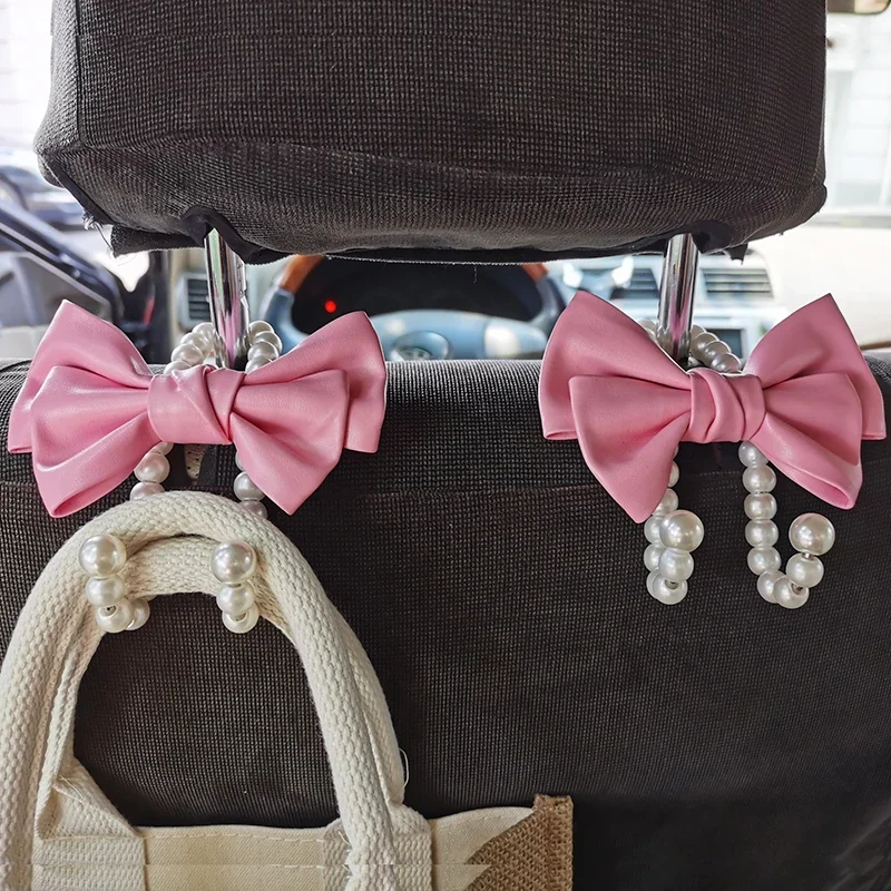 Gancho bonito con lazo para coche, elegante aleación de perlas, organizador de coche, Clip, colgador trasero de asiento de coche, ganchos duraderos y encantadores con nudo de lazo para coche
