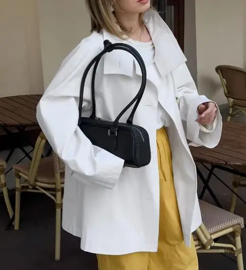 2025년 가을 패션 트렌드 단색 라펠 버튼 트렌치코트 여성 캐주얼 심플 스타일 루즈핏 긴팔 트렌치코트