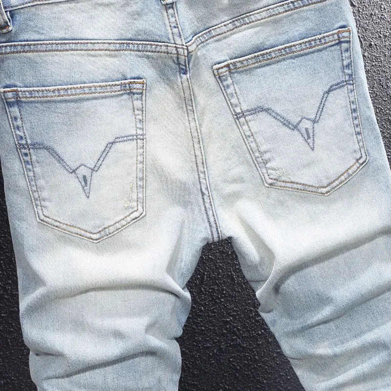 Y2Knew denim jeans, washed with nostalgia, elastic, slim fit, pleated, painted light blue jeans, high street embroidere