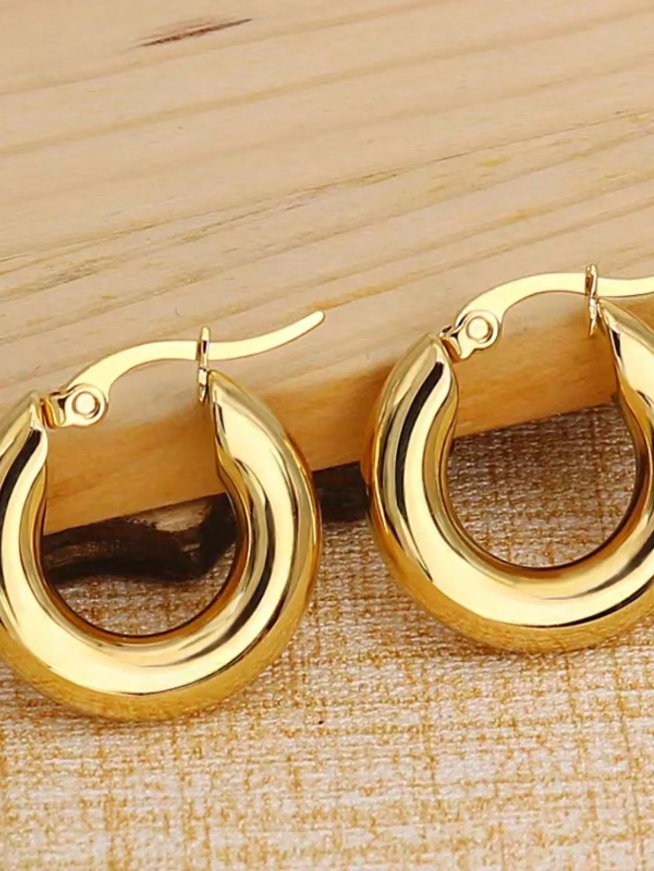 

Gold Tone Hoop Earrings with Sleek Curved Design for Everyday Wear