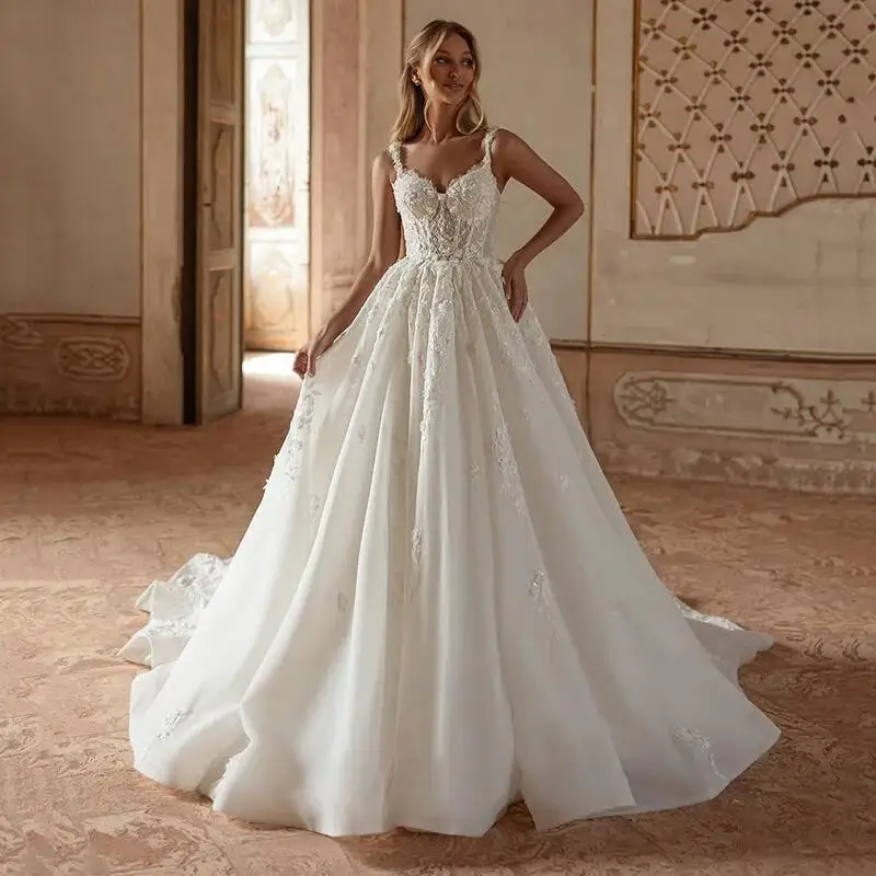 A-Linie Spaghettiträger Tüll Prinzessin Hochzeitskleid Sexy rückenfreie Brautkleider Luxus Spitzenapplikation Hochzeitskleid Maßgeschneidert