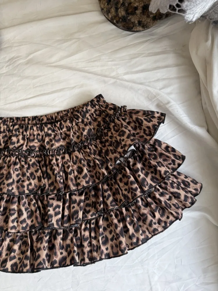 

Оригинальный дизайн, пятнистая ор-юбка Millennium с высокой талией, утягивающая бедра, закрывающая торт, длина f, женская модная ретро...