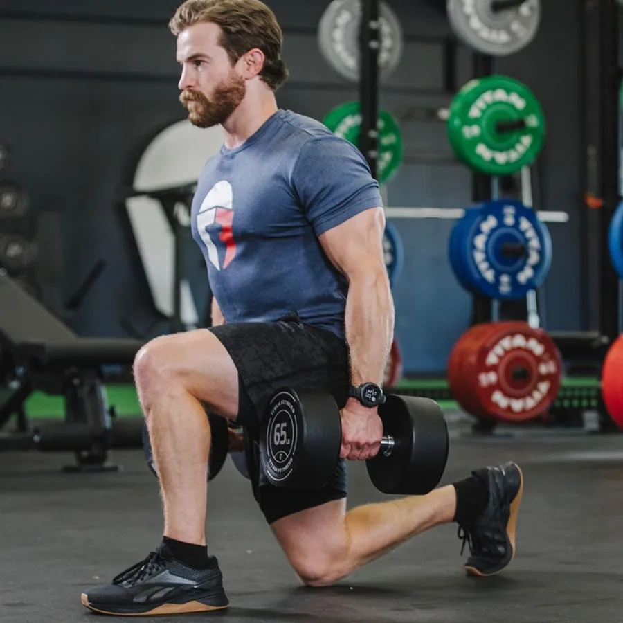 دمبل يوريتان مستدير مع تخريش بركان متوسط وقبضة 33 مم لتدريب القوة الفعالة والتي تتميز بوزن سهل القراءة