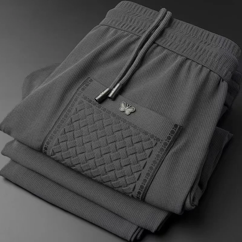 Light Luxury 2024 primavera e autunno Fashion Brand ricamo pantaloni Casual pantaloni morbidi lisci in seta da uomo pantaloni sportivi di fascia alta