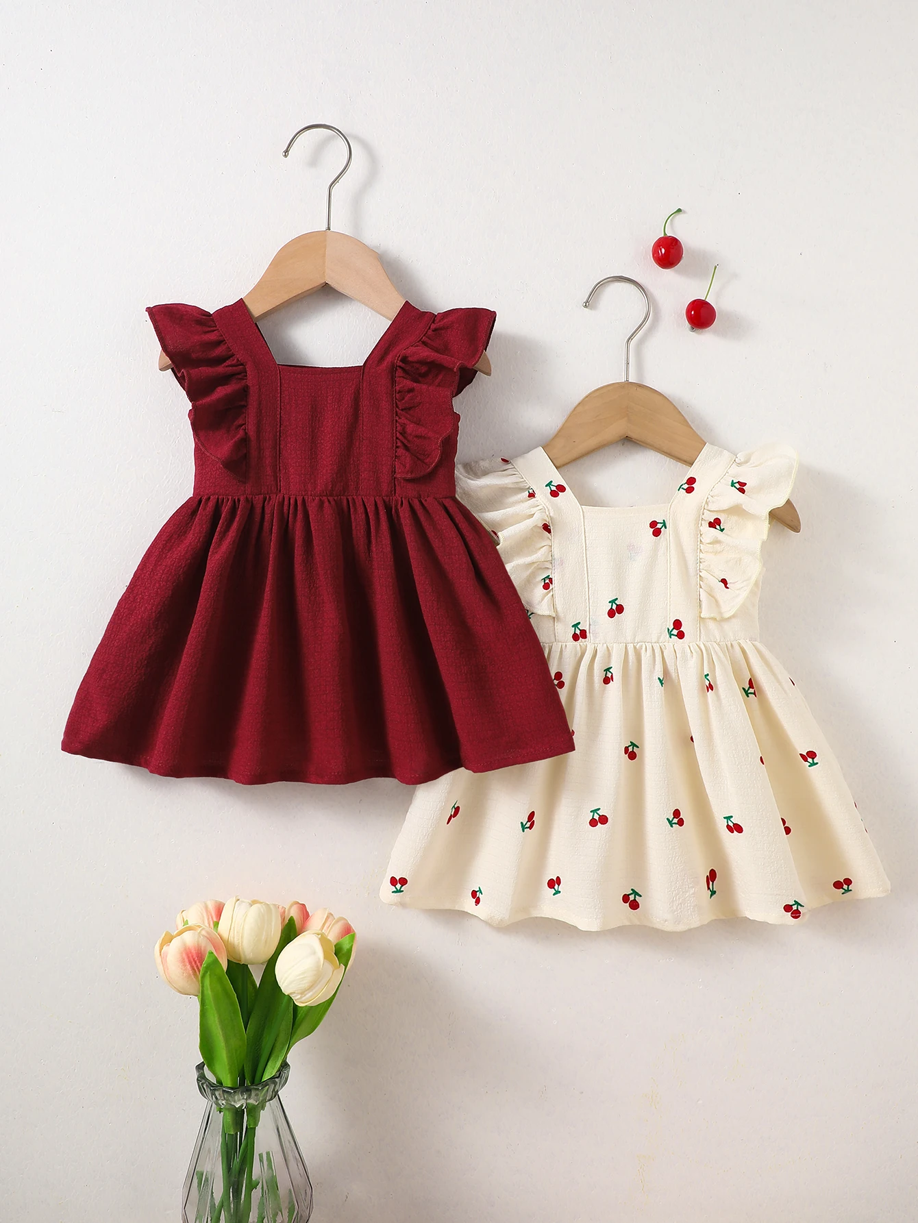 two-Piece Set: New Summer Arrivals for Baby Girls—Apricot and Red Ruffled Sleeveless Dresses with Adorable Cherry Prints.