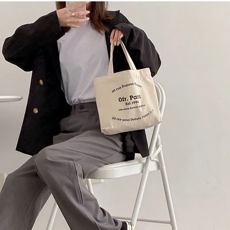 Mini bolso de mano de estilo coreano para mujer, bolsa de compras para Boutique de lona con estampado de letras, bolsa de almuerzo para mujer