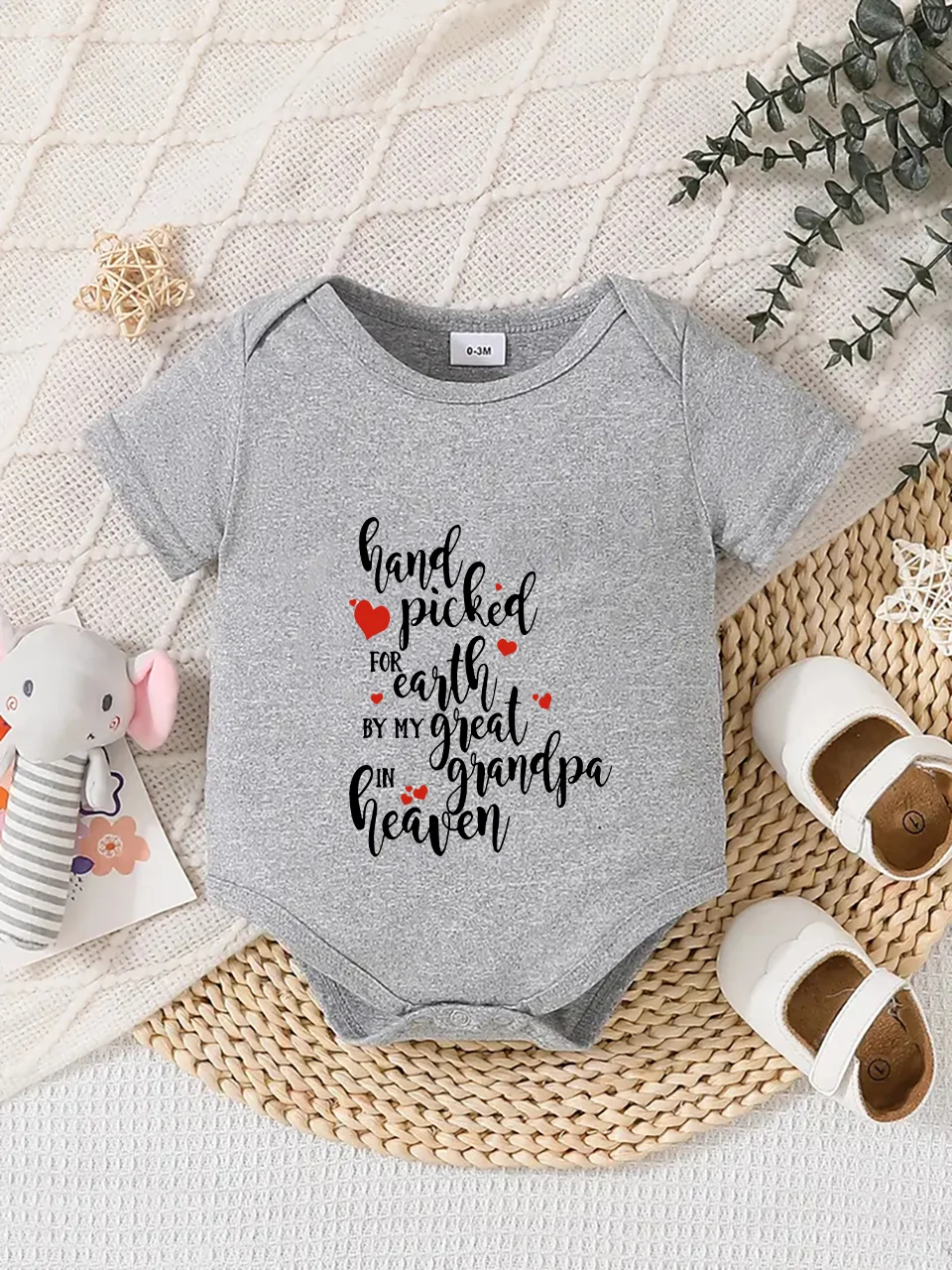 Playful letter-printed baby short-sleeve triangle bodysuit. Button closure for easy dressing