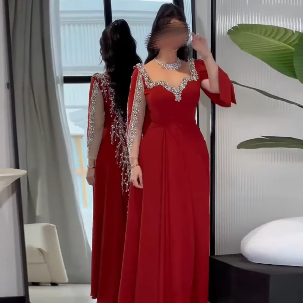 فساتين سهرة رائعة مخصصة على شكل قلب بأكمام طويلة من حجر الراين مطرزة بالخرز فستان حفلات طويل على شكل حرف a